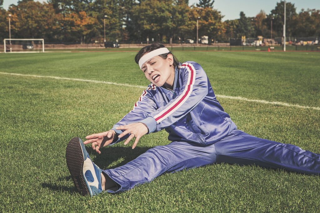 stretching, sports, woman, athlete, fitness, sport, healthy, nature, exercise, workout, young, female, body, lifestyle, training, fit, health, stretch, people, active, girl, adult, person, sportswear, athletic, gym, exercising, physical, sporty, white, pilates, leisure, tracksuit, track and field, shoes, headband, grass, field